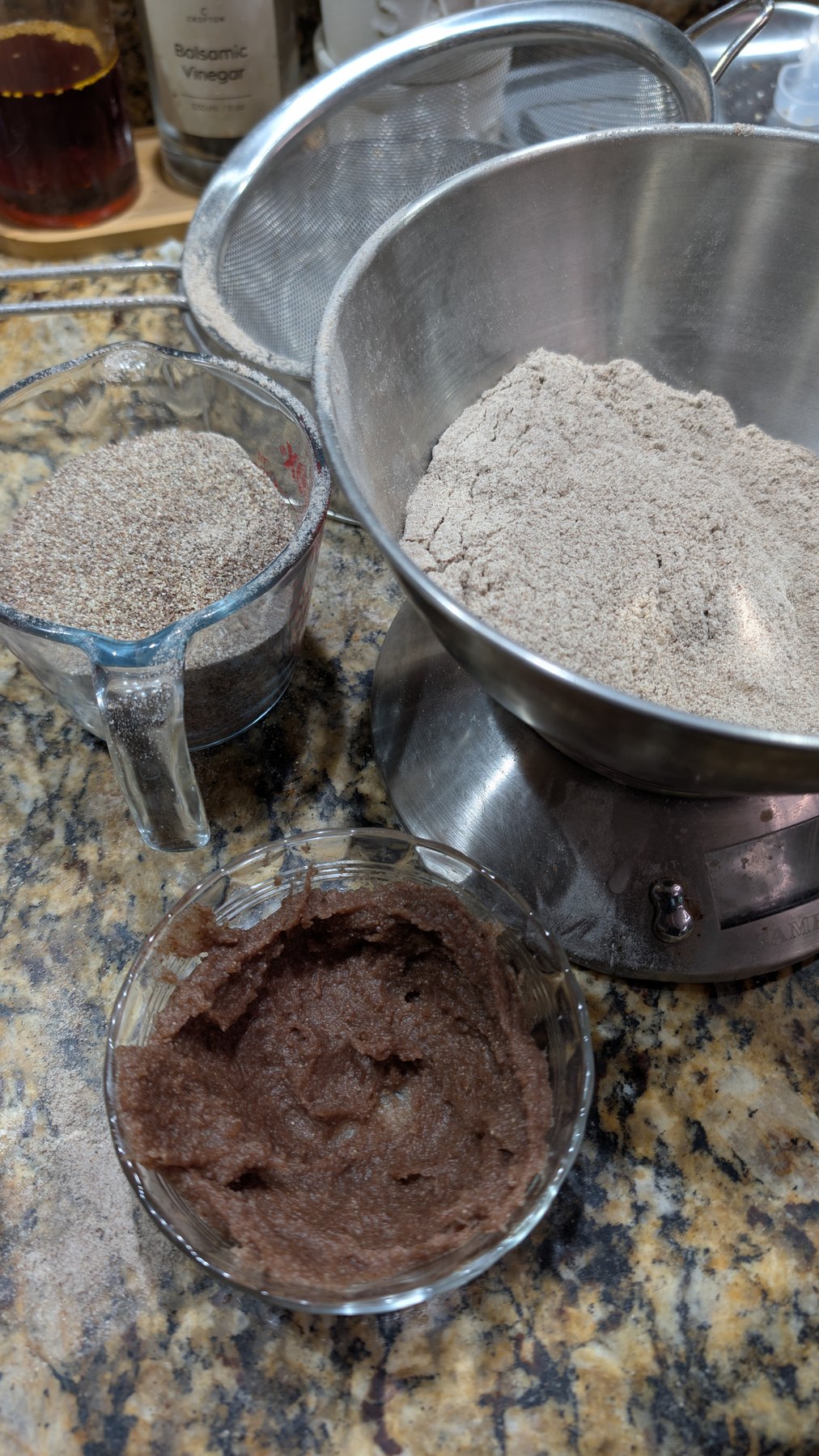Purple wheat flour, lievito madre, and flour weighed for a loaf